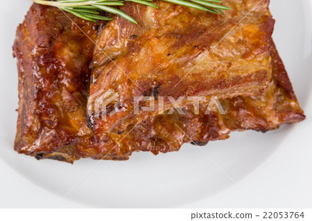 hot smoked barbecue ribs on white plate hot smoked barbecue ribs on white plate 22053764