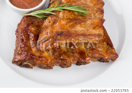 hot smoked barbecue ribs on white plate hot smoked barbecue ribs on white plate 22053765