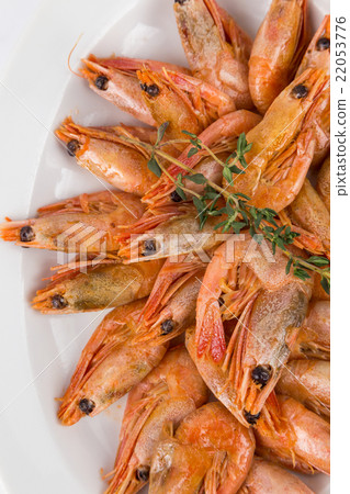 portion hot shrimps on white plate 22053776