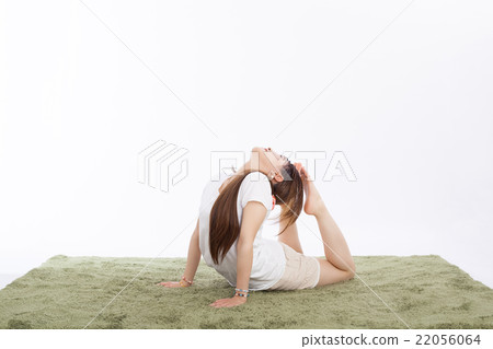 Healthy girls practicing yoga in the room 22056064