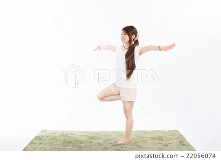 Healthy girls practicing yoga in the room 22056074
