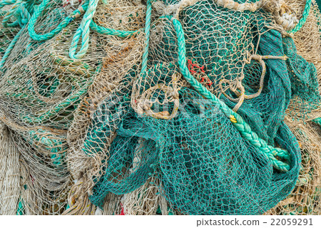 Fishing net by a harbor Fishing net by a harbor 22059291