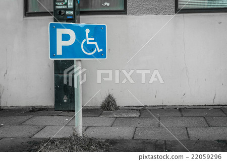 Handicap parking sign on a street 22059296