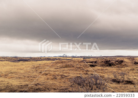 Dark clouds over a landscape in Iceland 22059333