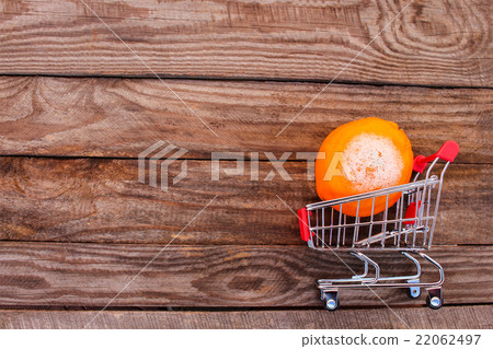 Shopping cart with rotten orange Shopping cart with rotten orange 22062497