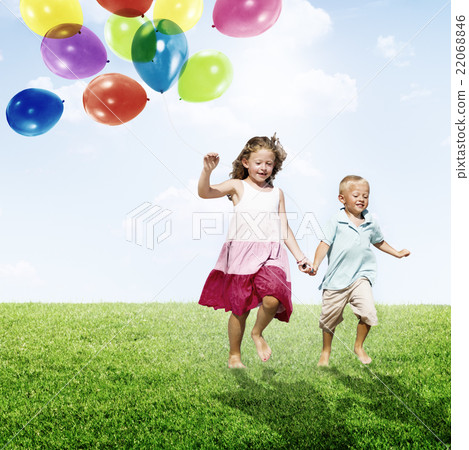Little Girl and Boy Outdoors Holding Balloons Concept Little Girl and Boy Outdoors Holding Balloons Concept 22068846