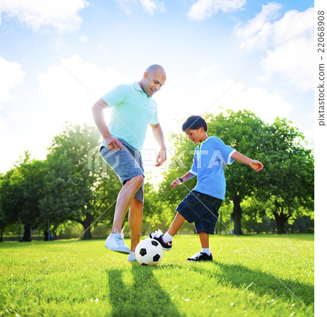 Little Boy Playing Soccer With His Father Concept Little Boy Playing Soccer With His Father Concept 22068908