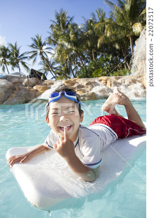 Boys playing in the pool Boys playing in the pool 22072517
