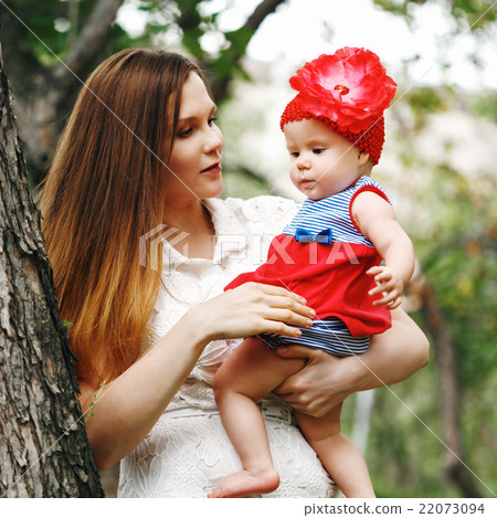 Mother and Daughter Together in Park Mother and Daughter Together in Park 22073094