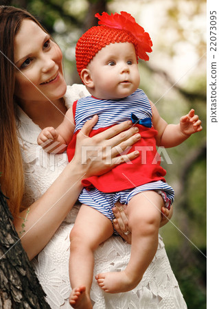 Mother and Daughter Together in Park Mother and Daughter Together in Park 22073095