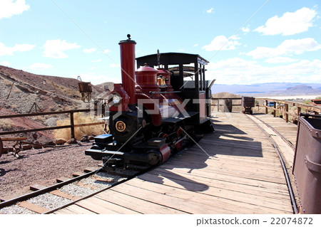 A steam locomotive running in a ghost town of a waste pit trace America A steam locomotive running in a ghost town of a waste pit trace America 22074872