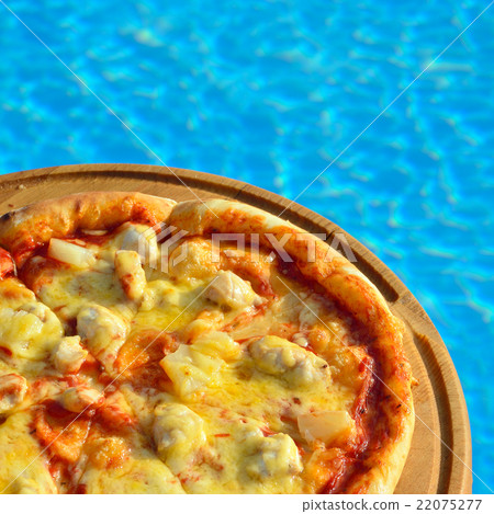pizza on swimming pool background pizza on swimming pool background 22075277