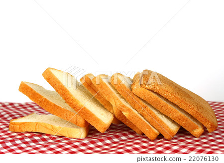 loaf of bread on tablecloth 22076130