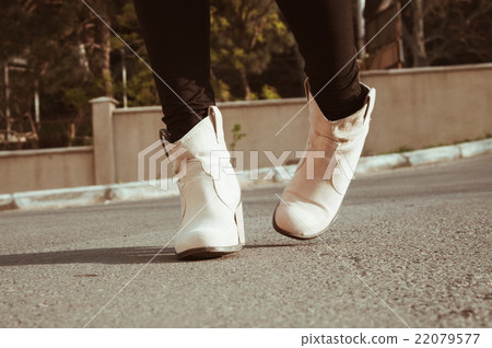 female legs closeup with casual shoes outdoor female legs closeup with casual shoes outdoor 22079577
