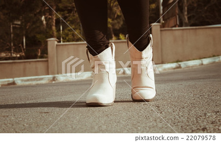 female legs closeup with casual shoes outdoor female legs closeup with casual shoes outdoor 22079578