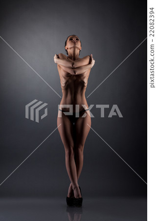 Image of slim girl posing topless hugging herself Image of slim girl posing topless hugging herself 22082394
