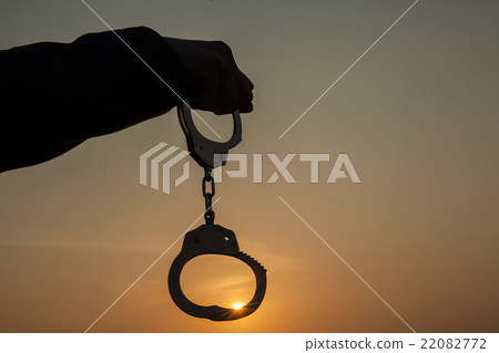 Business man showing handcuffs after releasing it 22082772