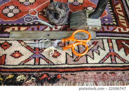 Big and small scissors,comb,beater on old carpet Big and small scissors,comb,beater on old carpet 22086747