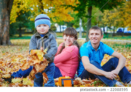 Young family with son playing in autumn park 22088595