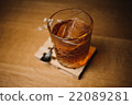 Whiskey drink with  ice  on  wood in bar 22089281