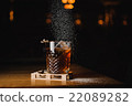 dusting whiskey drink with  ice  on  wood in bar 22089282