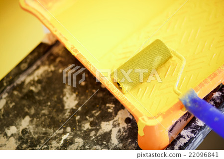 Painting tools, yellow roller in tray with acrylic 22096841