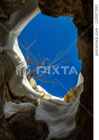 View of blue sky from caves. 22097393