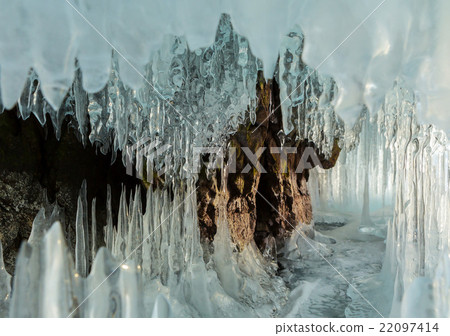 Ice stalactites and stalagmites in the rock. Ice stalactites and stalagmites in the rock. 22097414