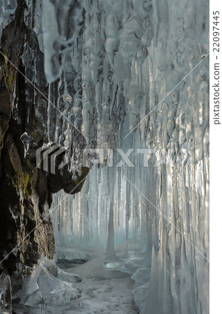 Ice stalactites and stalagmites in the rock. Ice stalactites and stalagmites in the rock. 22097445