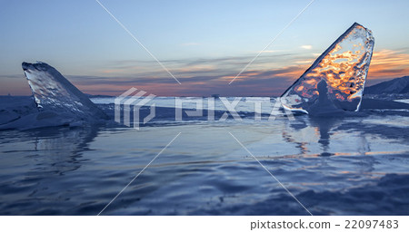 Transparent icicles at sunset. Transparent icicles at sunset. 22097483