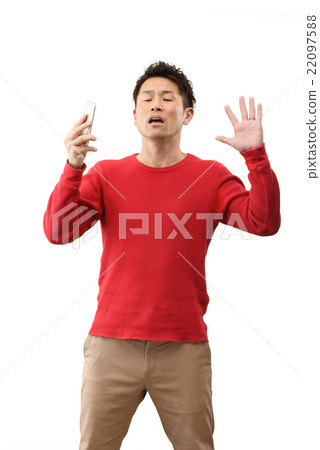 人的圖像在他們的30s便衣站立白色後面與智能手機 22097588