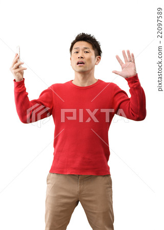 Image of men in their 30s casual wear standing white back with a smartphone 22097589