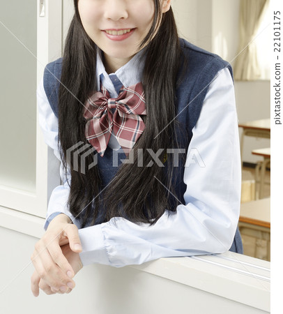 Girls high school students looking through the window with a smile 22101175