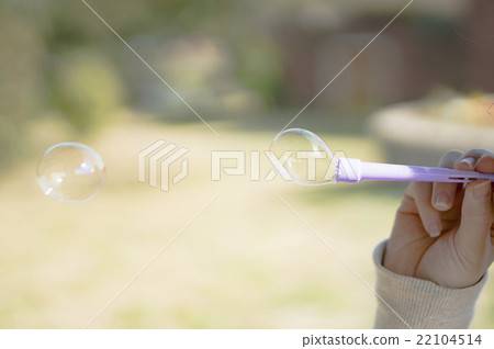 Blowing blowing soap bubbles Blowing blowing soap bubbles 22104514