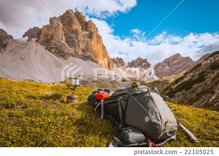 Camping gas and backpack on Alps background Camping gas and backpack on Alps background 22105025