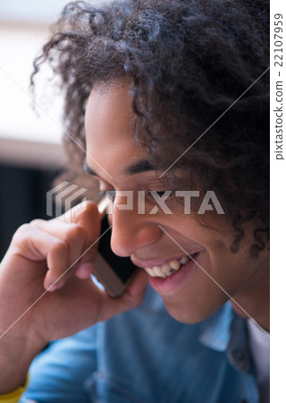 Positive guy talking on smart phone  22107959