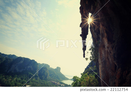 sunrise through the cliff at seaside 22112754