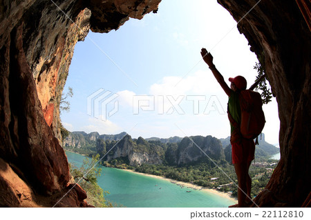 cheering young  woman hiker  enjoy the view   22112810