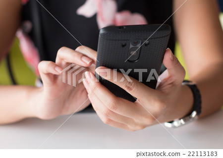 Close up of hands woman using her cell phone 22113183