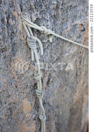 carbine and rope in stone carbine and rope in stone 22113559