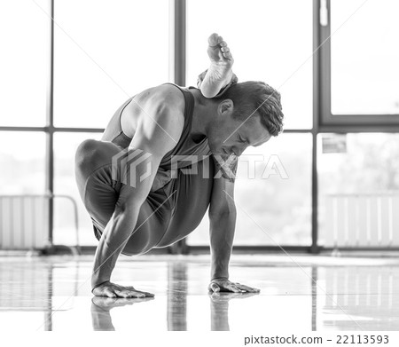 Athletic muscular young man working out, yoga 22113593