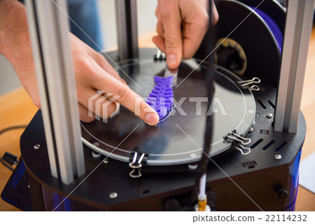 Pleasant person  using 3d printer  22114232