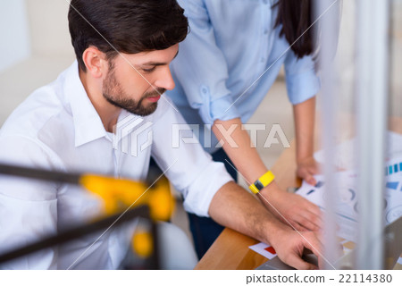 Positive colleagues working at the table Positive colleagues working at the table 22114380