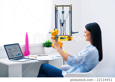Cheerful woman sitting at the table Cheerful woman sitting at the table 22114451