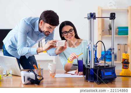 Pleasant smilin g colleagues sitting at the table 22114860