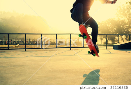 skateboarding woman at sunrise skatepark 22116886