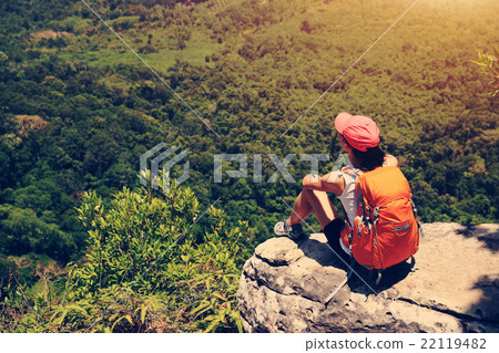 woman hiker enjoy the view on mountain top cliff 22119482