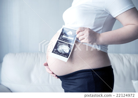 Pregnant woman with ultrasound scan picture Pregnant woman with ultrasound scan picture 22124972