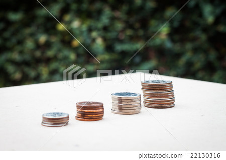 Money coin growing graph with green background Money coin growing graph with green background 22130316