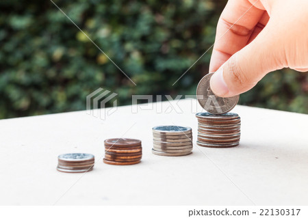 Woman hand putting money coin Woman hand putting money coin 22130317